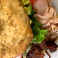Turkey Bacon Avocado Sandwich · Natural turkey breast, thinly sliced with fresh avocado spread, crispy bacon, lettuce, tomat...