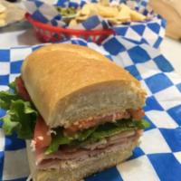 Heroes Club Sandwich · Ham, bacon, turkey, and cheese served with lettuce, tomato, and mayonnaise on an Italian hoa...