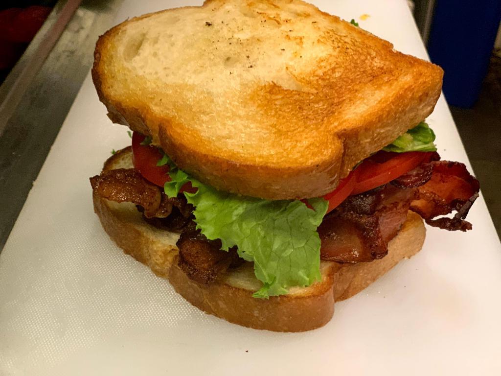BLT Sandwich · A generous portion of Applewood smoked bacon with lettuce, tomato, and mayonnaise on toasted Sourdough bread.