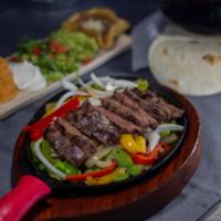 Steak Fajitas · Sizzling platter of caramelized onions, tomatoes, jalapeños marinated, grilled outer skirt s...