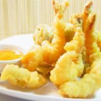 Tempura · Shrimp and vegetables dipped in our own tempura batter and deep fried.