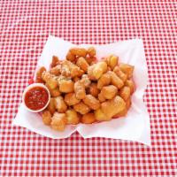 Beer Nuggets · Deep-fried homemade dough nuggets sprinkled with Parmesan cheese and butter garlic sauce.