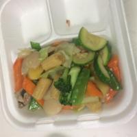 Moo Goo Gai Pan · Chicken with mushrooms, carrots, zucchini, snow peas and napa in white sauce. Served with st...