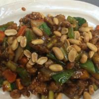 Kung Pao Chicken · Chicken with diced carrots, bamboo shoots and zucchini in brown sauce. Served with steamed o...