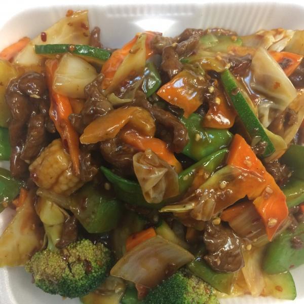 Hunan Chicken · Chicken, zucchini, carrots, yellow onion and green pepper stir fried in spicy Hunan sauce. Served with steamed or fried rice and fortune cookies.