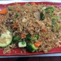 Vegetable Fried Rice · Mixed vegetables cooked with fried rice and eggs.