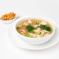 Wonton Soup · Wontons, shrimp, white chicken, broccoli, carrots, water chestnuts, and mushrooms.