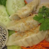 9. Six Piece Thai Dumplings · Deep fried shrimp wrapped in spring roll wrapper served with sweet and sour sauce.