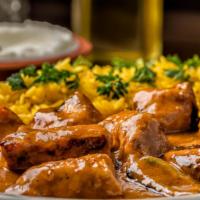 C10. Creamy Chicken Tekka · 2 skewers of chicken tenders marinated, spiced the authentic way, grilled and pampered with ...
