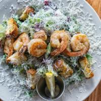 Shrimp Caesar Salad · Sauteed shrimp over a bed of greens with house made croutons and Caesar dressing.