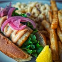 Spicy Scallop Roll Sandwich · Pan-seared scallops on a toasted New England-style bun with spicy chili mayo and pickled red...