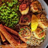 Pan Seared Scallop Plate · Served over rice pilaf with mushy peas and roasted carrots.
