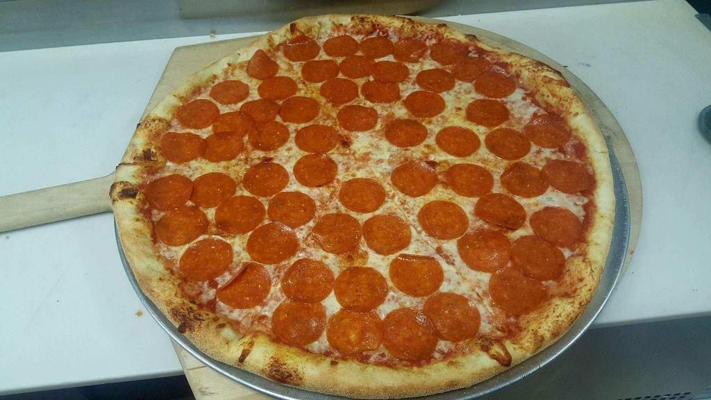 Pepperoni Pizza · An American tradition. Mozzarella cheese and pepperoni with tomato sauce.