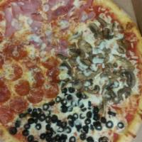 4 Stagioni Pizza · Chef's 4 choice combination: mozzarella cheese, black olives, mushrooms, ham, pepperoni and ...
