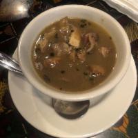 Light Pepper Soup · Light peppery soup with choice of goat or boneless fish.