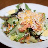 Small Traditional Salad · Mixed greens, tomatoes, cucumbers, cheddar jack cheese, and hard boiled egg.