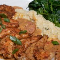 Shrimp and Grits · Blackened large shrimp, jalapeno cheese grits, sauteed spinach, and smoked andouille gravy.