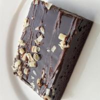 Decadent Chocolate Brownie · Iced chocolate brownie. Served with chocolate and caramel sauce. Brownie does contain nuts!