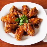 9. Thai Spicy Wings · 8 pieces. Fried chicken wings covered with spicy garlic sauce. Hot and spicy.