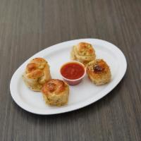 Garlic Knots · 4 pieces. Add sauce for an additional charge.