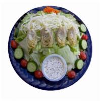 Garden Salad · Lettuce, tomatoes, cucumbers, carrots, mozzarella cheese, olives and artichoke hearts.
