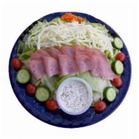 Chef Salad · Lettuce, tomatoes, cucumbers, carrots, mozzarella cheese, olives and ham.