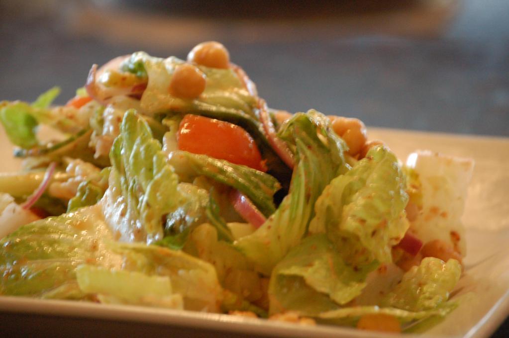 Greco Salad · Crisp romaine lettuce with feta cheese, tomato, cucumbers, green peppers, olives and red onions. Tossed with a homemade Greek dressing.