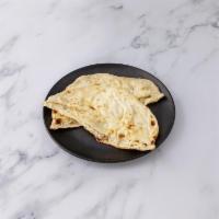 Naan · Leavened white hand-stretched bread. Freshly baked to order.