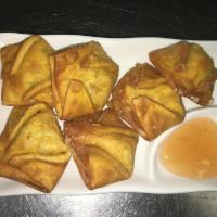 B4. Fried Crab Cheese Wontons 炸蟹角（6） · Homemade crab and cream cheese filling wrapped and deep-fried. Each order comes with six.