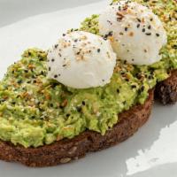 Classic Avocado Toast · Thick sliced artisan grain bread lightly toasted and topped with fresh avocado, 2 poached eg...