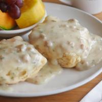 Betty's Southern Biscuit and Gravy · A homemade buttermilk biscuit smothered with country gravy and topped with bacon or sausage....