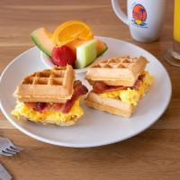 Waffle Sandwich · A Belgian waffle sandwich filled with scrambled eggs, cheddar cheese and applewood-smoked ba...
