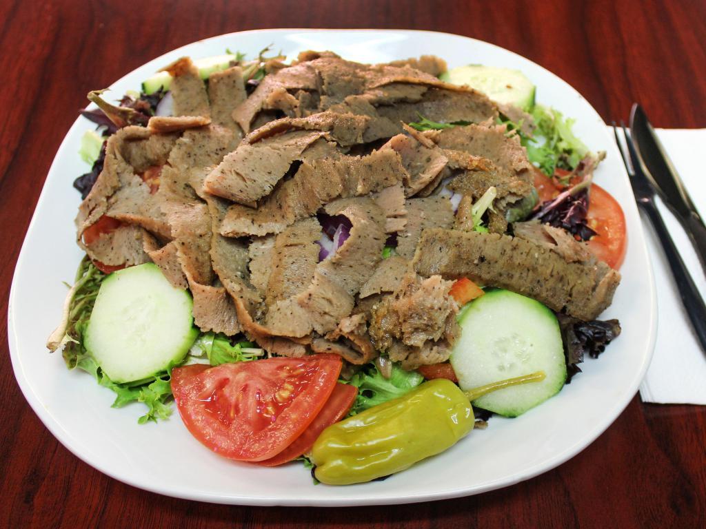 Gyros Salad · Greek salad topped with gyros meat. Served with olive oil and fresh lemon juice.