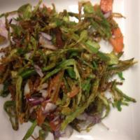 Kur Kuri Bhindi Chaat · Fresh crispy okra tossed with tomatoes, cucumbers, onions and spices, dressed with a tangy s...
