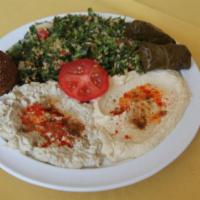 Vegetarian Meza · Hummus, falafel, mutabal, tabbouleh, salad, stuffed grape leaves, and pita bread with Greek ...