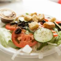 Garden Salad · Fresh mixed greens, tomatoes, cucumbers, onions, black olives, croutons and bread.