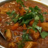 Chicken Curry Dinner Combo  · Boneless chicken cooked in a mild spicy sauce.