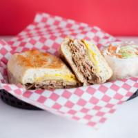 Alicia's Cuban Sandwich · Slow wood smoked pork and ham, smoked Swiss cheese, yellow mustard, and pickle on a butter b...