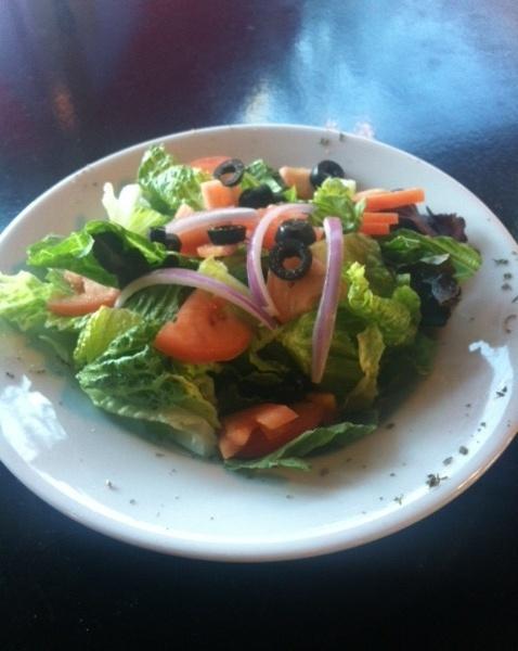House Salad · Mixed greens with tomatoes, red onions and black olives.
