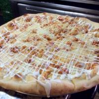 Buffalo Chicken Pizza · Freshly made pizza dough with grilled chicken tossed in a spicy wing sauce and drizzled with...