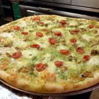 Pesto Chicken Pizza · Basil pesto with grilled chicken, mozzarella cheese, and tomatoes topped with fresh mozzarel...