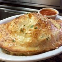 Cheese Calzone · Served with fresh marinara sauce. Our freshly made dough filled with seasoned ricotta cheese...