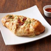 BBQ Chicken Bacon Stromboli · BBQ chicken, bacon and mozzarella cheese drizzled with homemade BBQ sauce. 
