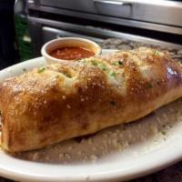 Sausage and Peppers Stromboli · Italian sausage, sweet peppers, onions, fresh marinara and mozzarella cheese.