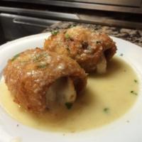 Chicken Rollatini · Breaded chicken breast and bacon, rolled and filled with mozzarella cheese and topped with a...