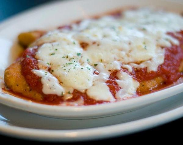 Chicken Parmesan · Breaded chicken breast topped with marinara sauce and mozzarella cheese.