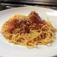 Spaghetti and Meatballs · Spaghetti and meatballs smothered in our house marinara sauce.
