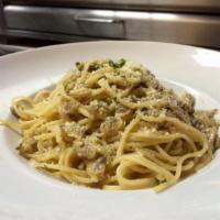 Spaghetti with Clams · Spaghetti with clams tossed in our homemade white clam sauce.