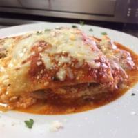 Lasagna al Forno · Layered lasagna pasta with seasoned ricotta, ground beef, mozzarella cheese and marinara sau...