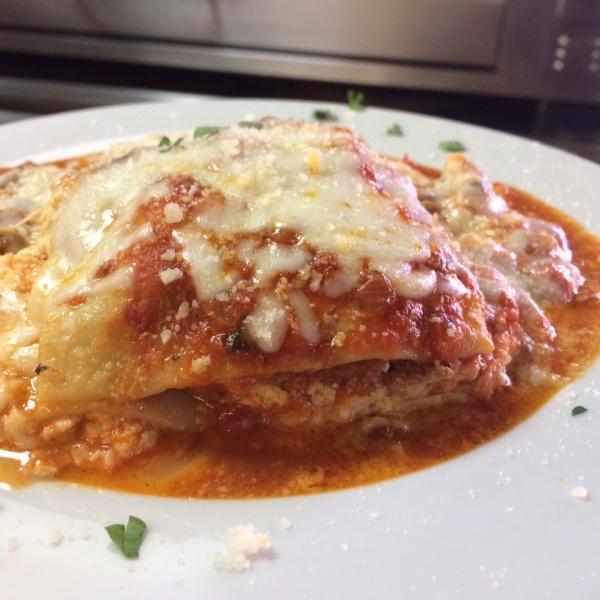 Lasagna al Forno · Layered lasagna pasta with seasoned ricotta, ground beef, mozzarella cheese and marinara sauce.